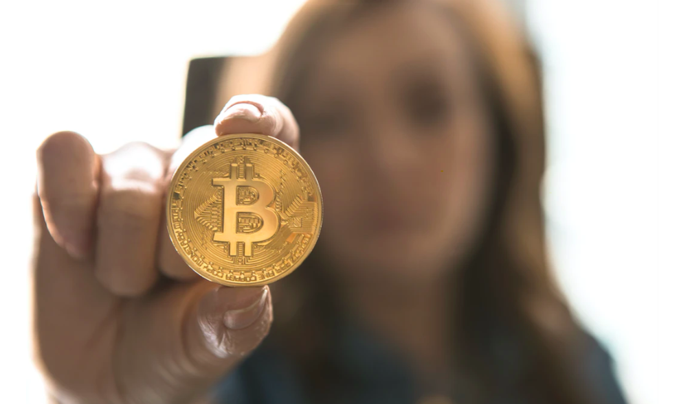Woman with Bitcoin coin